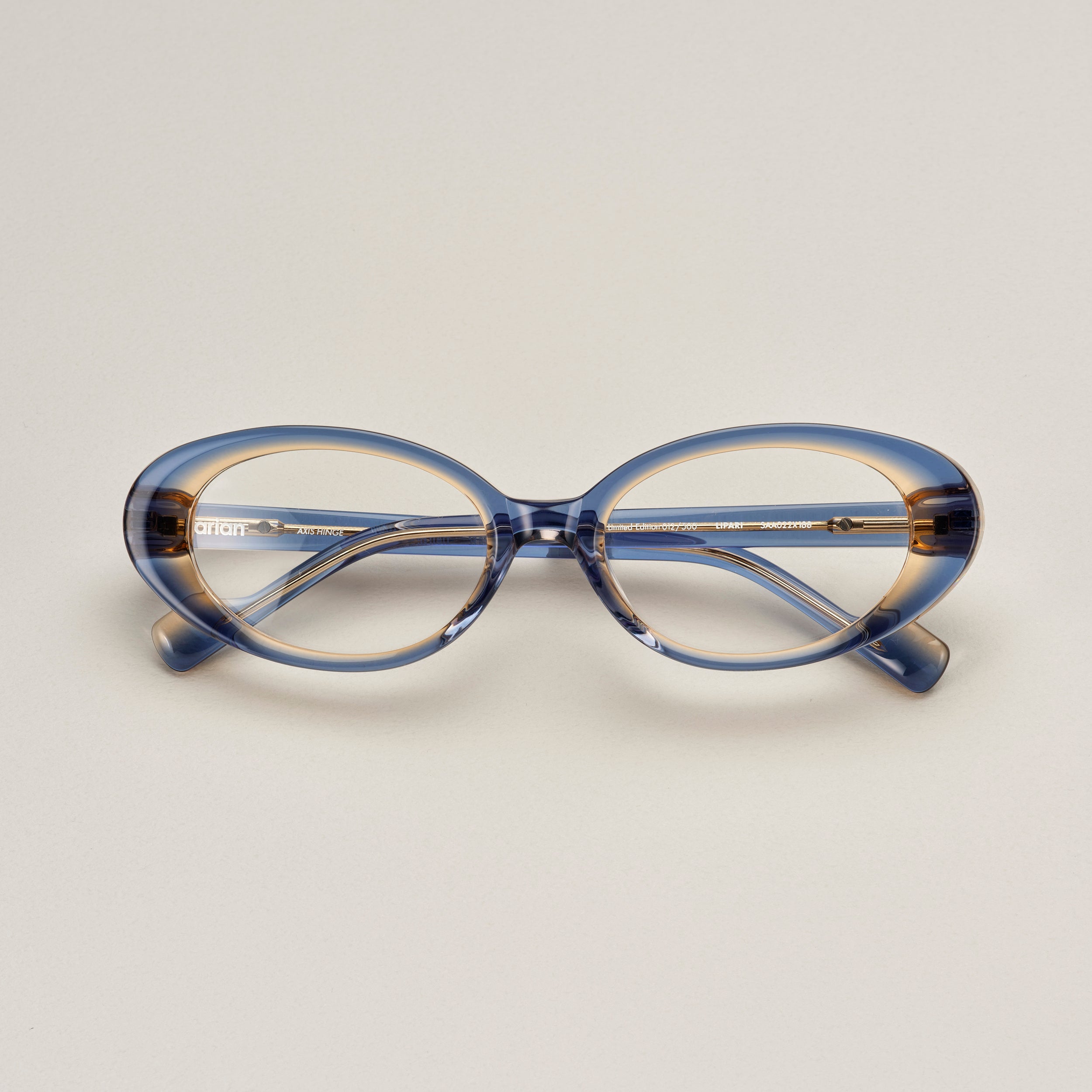 Tarian-Lipari-small-oval-cateye-eyewear-clear-blue-yellow