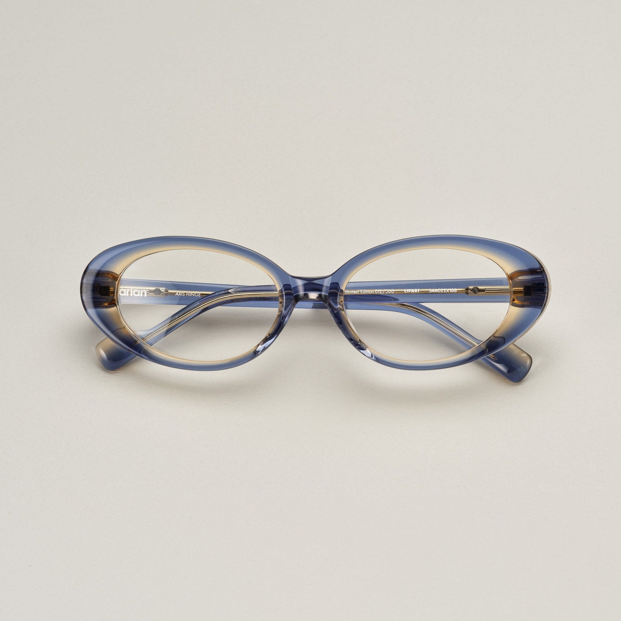 Tarian-Lipari-small-oval-cateye-eyewear-clear-blue-yellow